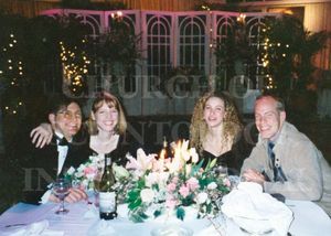 Marc and Claire with friends and colleagues at a dinner party