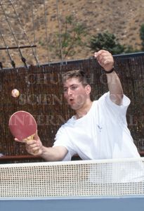 Marc playing a lively game of table tennis with colleagues at Golden Era